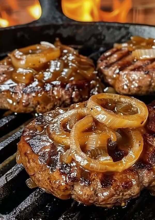 Juicy grilled beef patties topped with caramelised onions 1