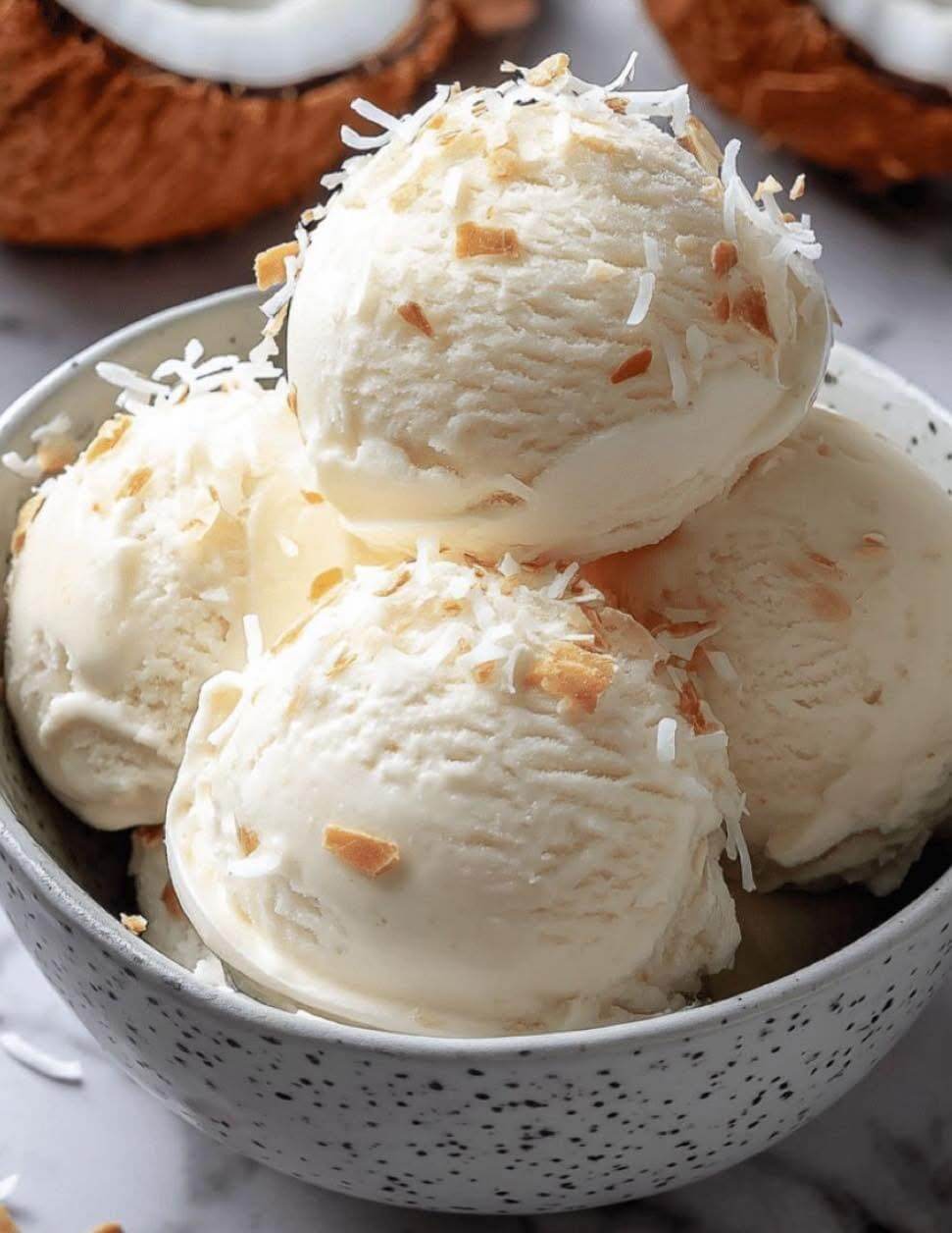 Coconut Ice Cream Topped With Toasted Coconut Flakes 1